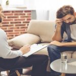 Man sitting in front of therapist