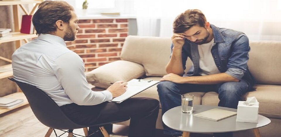 Man sitting in front of therapist